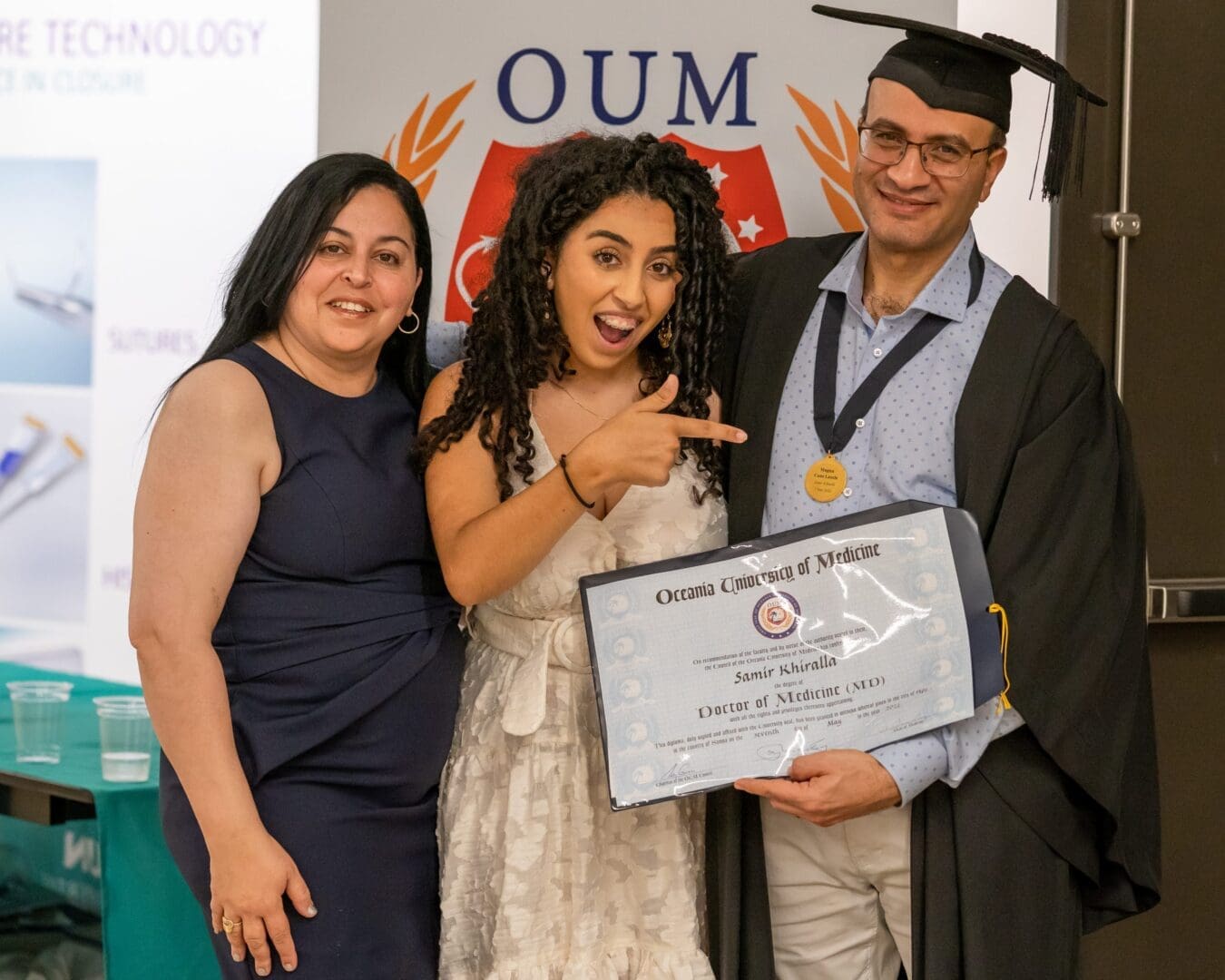 OUM Graduates near OUM banner