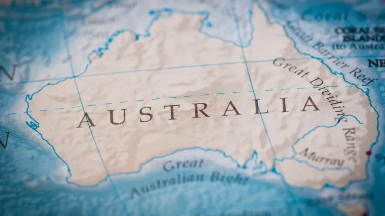 Close-up of a map highlighting Australia, with surrounding oceans and geographic features labeled