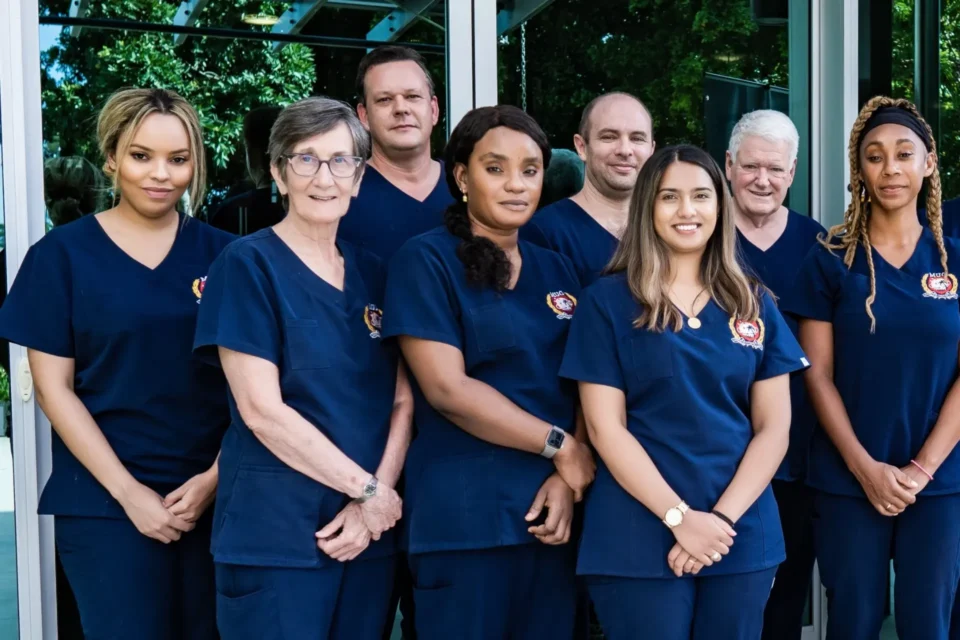 diverse doctors wearing OUM blue scrubs