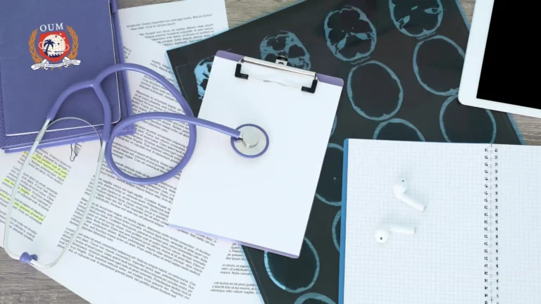 top view of a clipboard, notebook, foolder, oum agenda, and a stethoscope